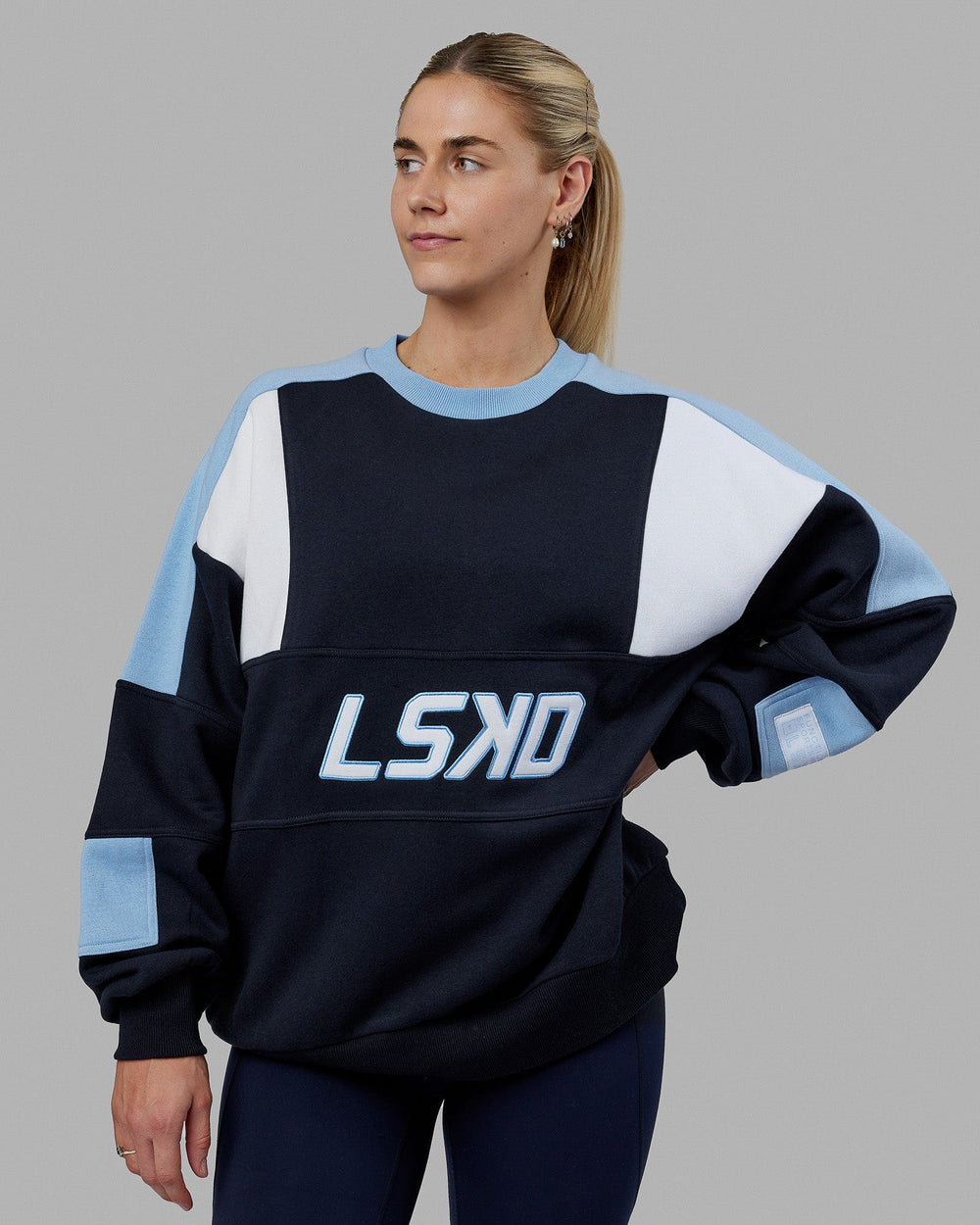 Woman wearing Unisex Slam Sweater Oversize - Navy-Blue