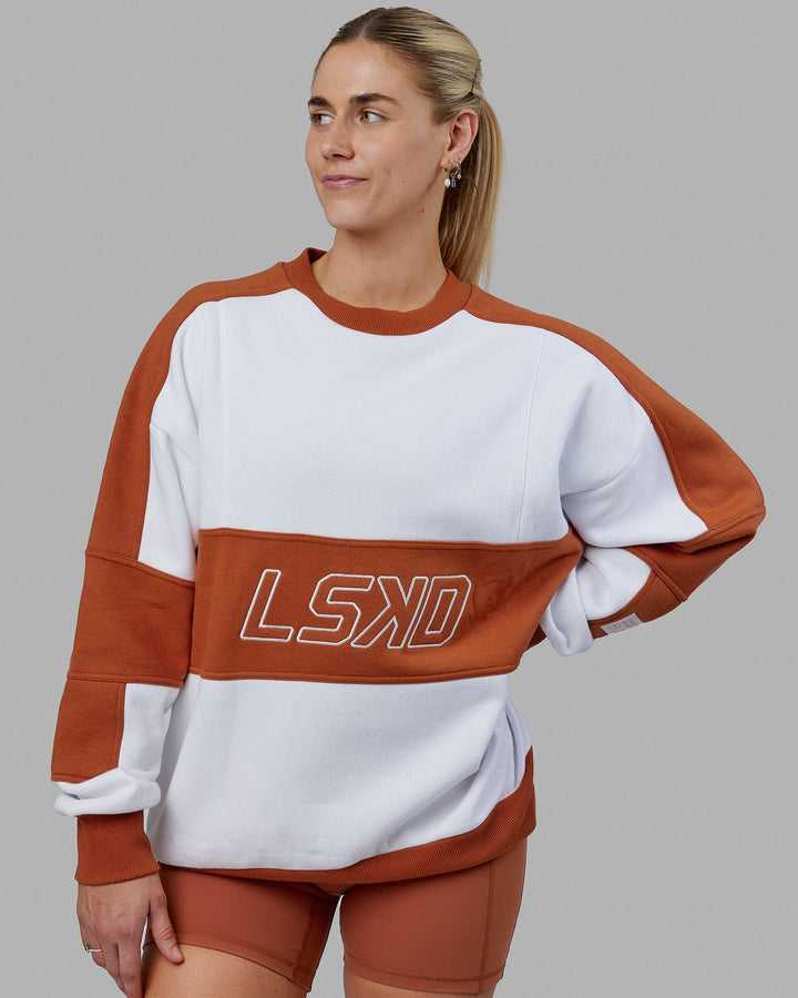 Woman wearing Unisex Slam Sweater Oversize - White-Orange