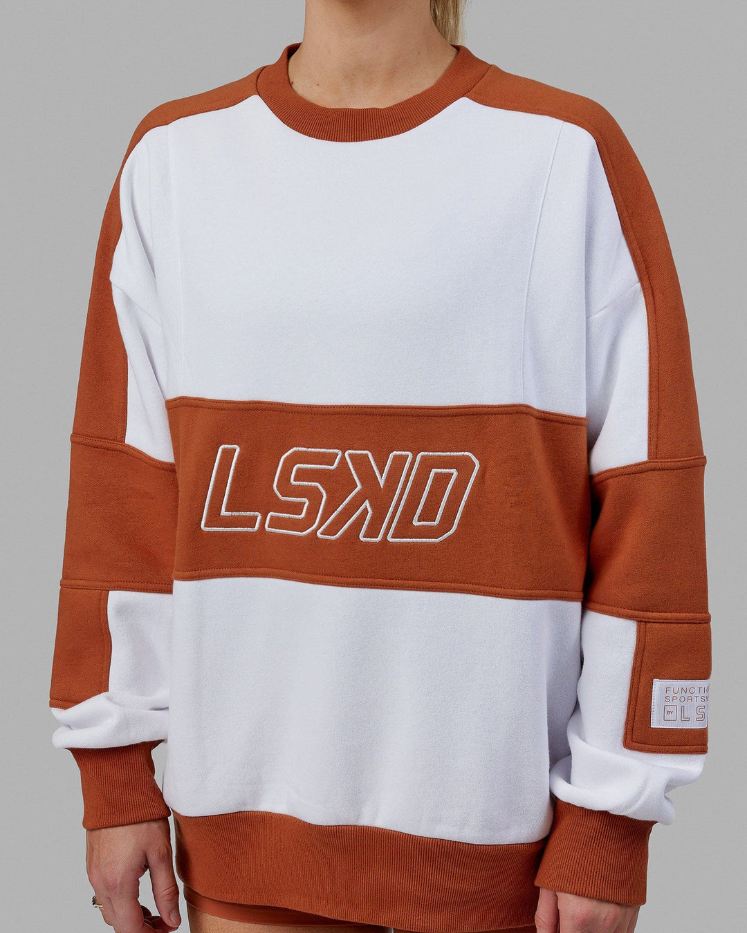 Woman wearing Unisex Slam Sweater Oversize - White-Orange