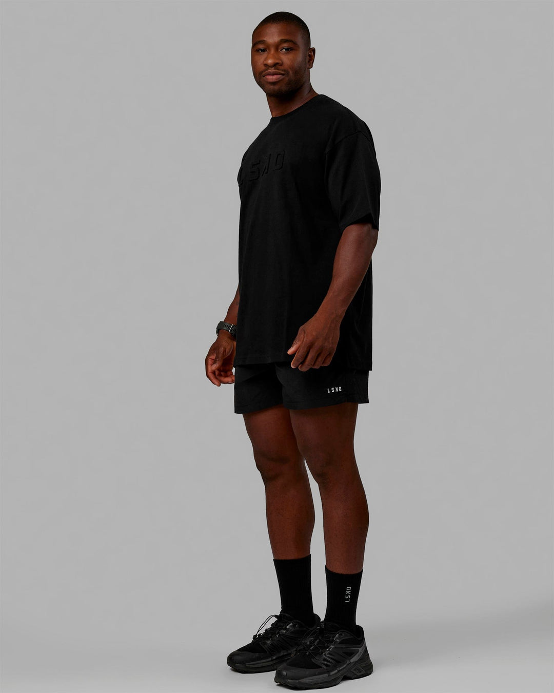 Man wearing Unisex Stamped 2.0 Heavyweight Tee Oversize - Black