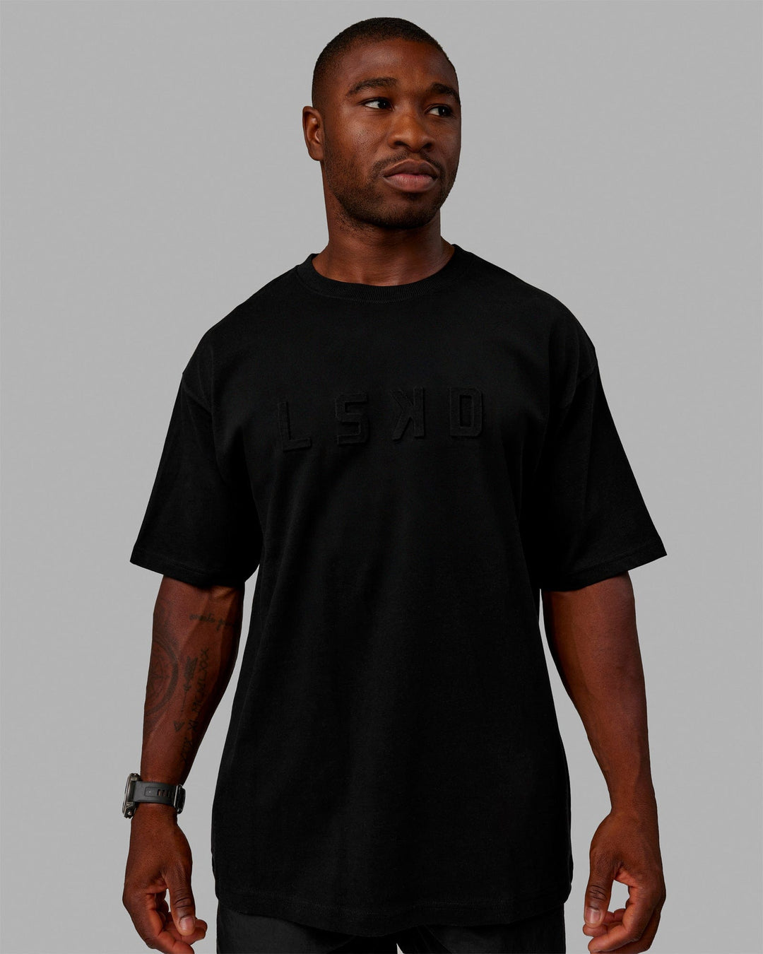 Man wearing Unisex Stamped 2.0 Heavyweight Tee Oversize - Black