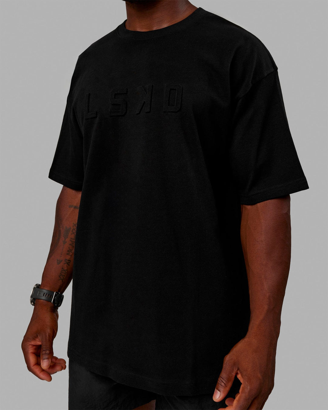 Man wearing Unisex Stamped 2.0 Heavyweight Tee Oversize - Black