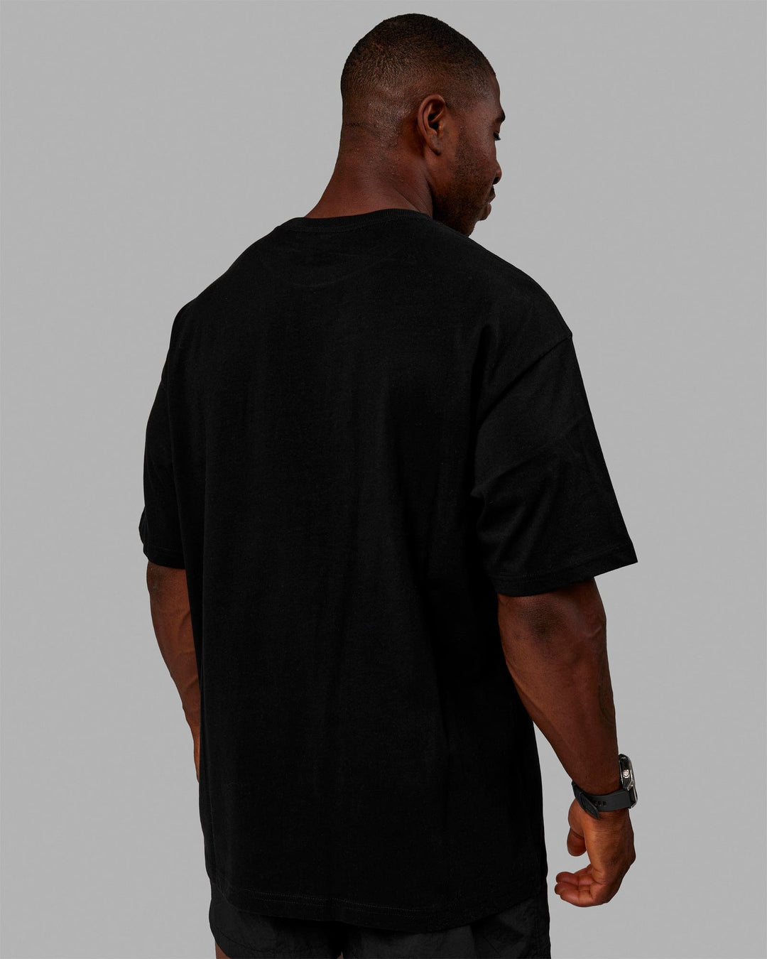 Man wearing Unisex Stamped 2.0 Heavyweight Tee Oversize - Black