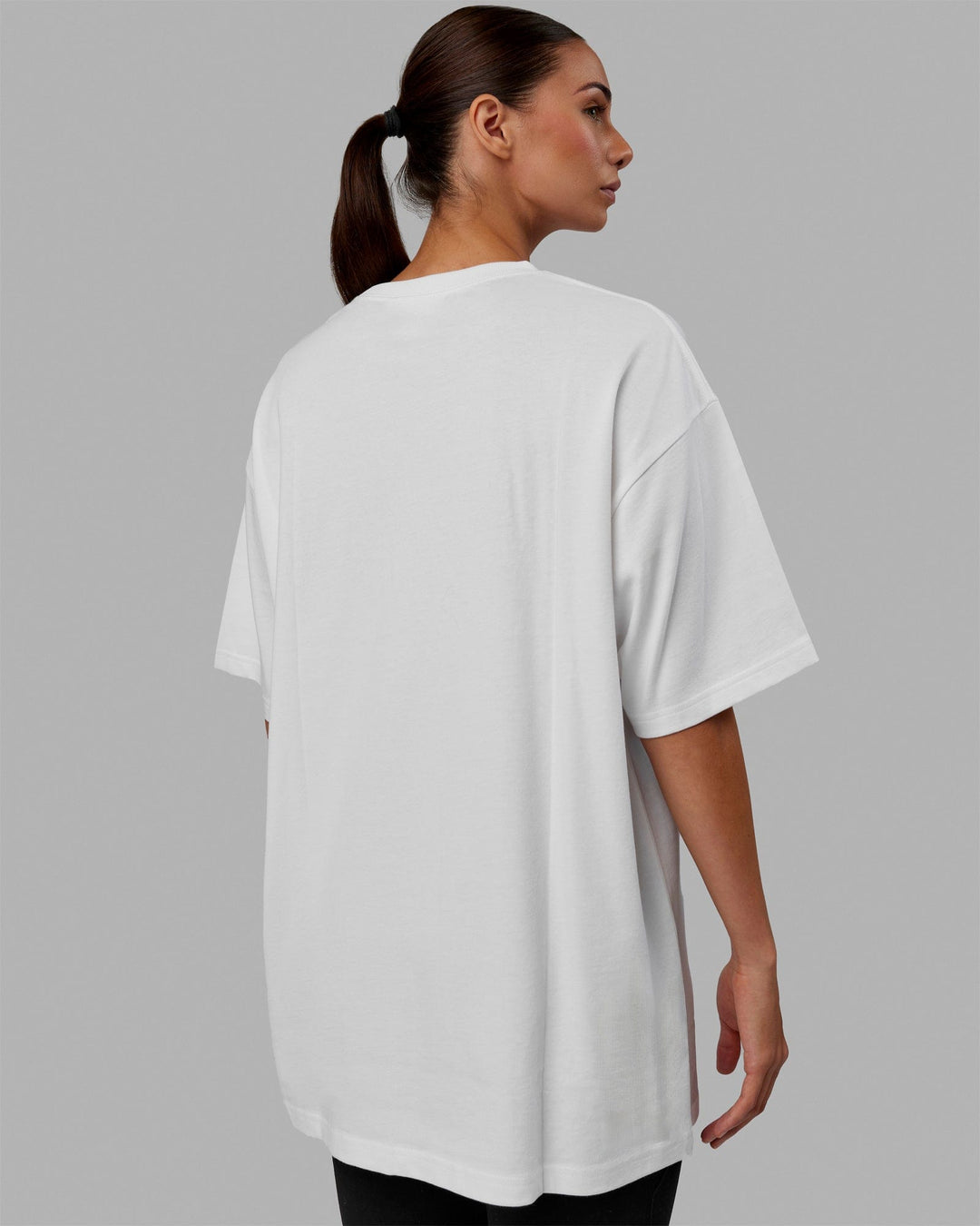 Woman wearing Unisex Stamped 2.0 Heavyweight Tee Oversize - White