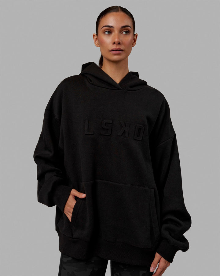 Woman wearing Unisex Stamped Hoodie Oversize - Black