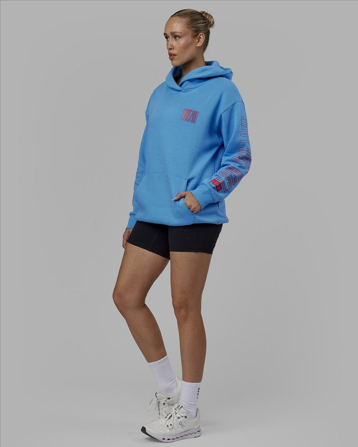 Woman wearing Unisex Stretch It Hoodie Oversize - Azure Blue