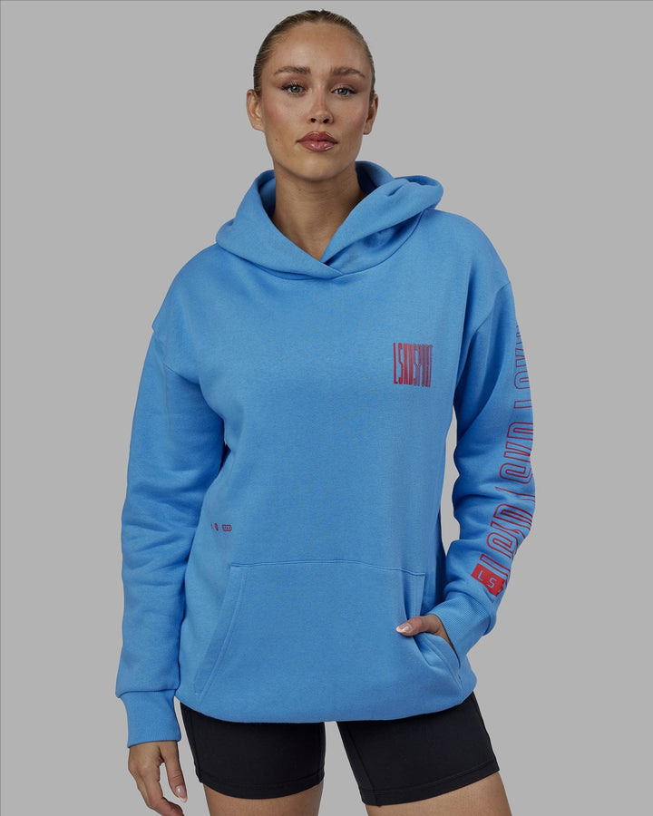 Woman wearing Unisex Stretch It Hoodie Oversize - Azure Blue