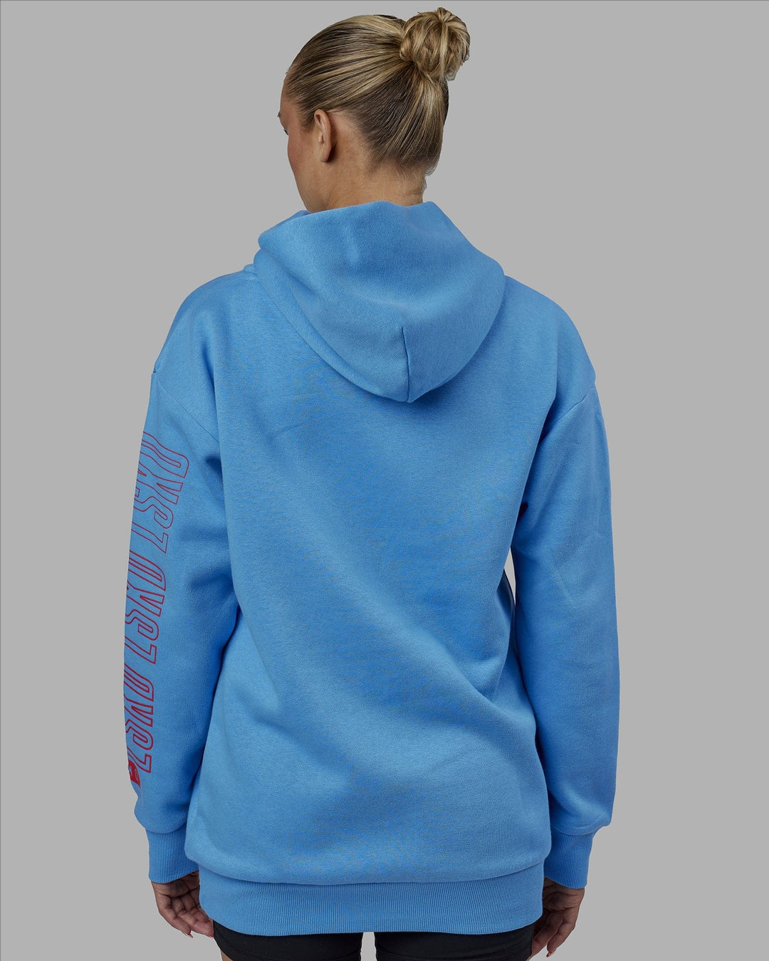 Woman wearing Unisex Stretch It Hoodie Oversize - Azure Blue