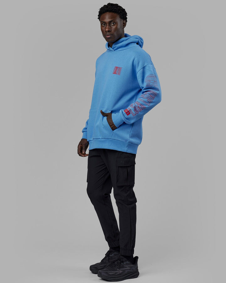 Man wearing Unisex Stretch It Hoodie Oversize - Azure Blue