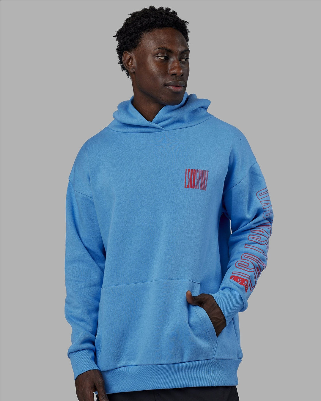 Man wearing Unisex Stretch It Hoodie Oversize - Azure Blue