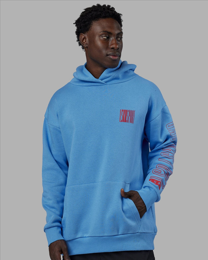 Man wearing Unisex Stretch It Hoodie Oversize - Azure Blue