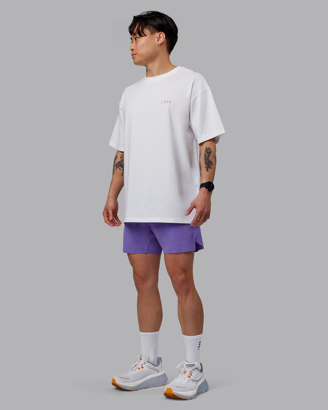 Man wearing Unisex Strike Through FLXCotton Tee Oversize - White-Purple Swirl