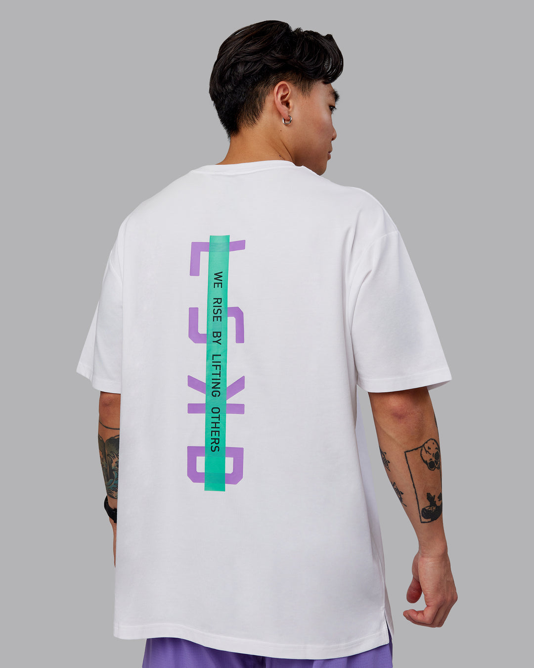 Man wearing Unisex Strike Through FLXCotton Tee Oversize - White-Purple Swirl