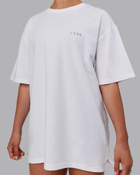 Woman wearing Unisex Strike Through FLXCotton Tee Oversize - White-Purple Swirl
