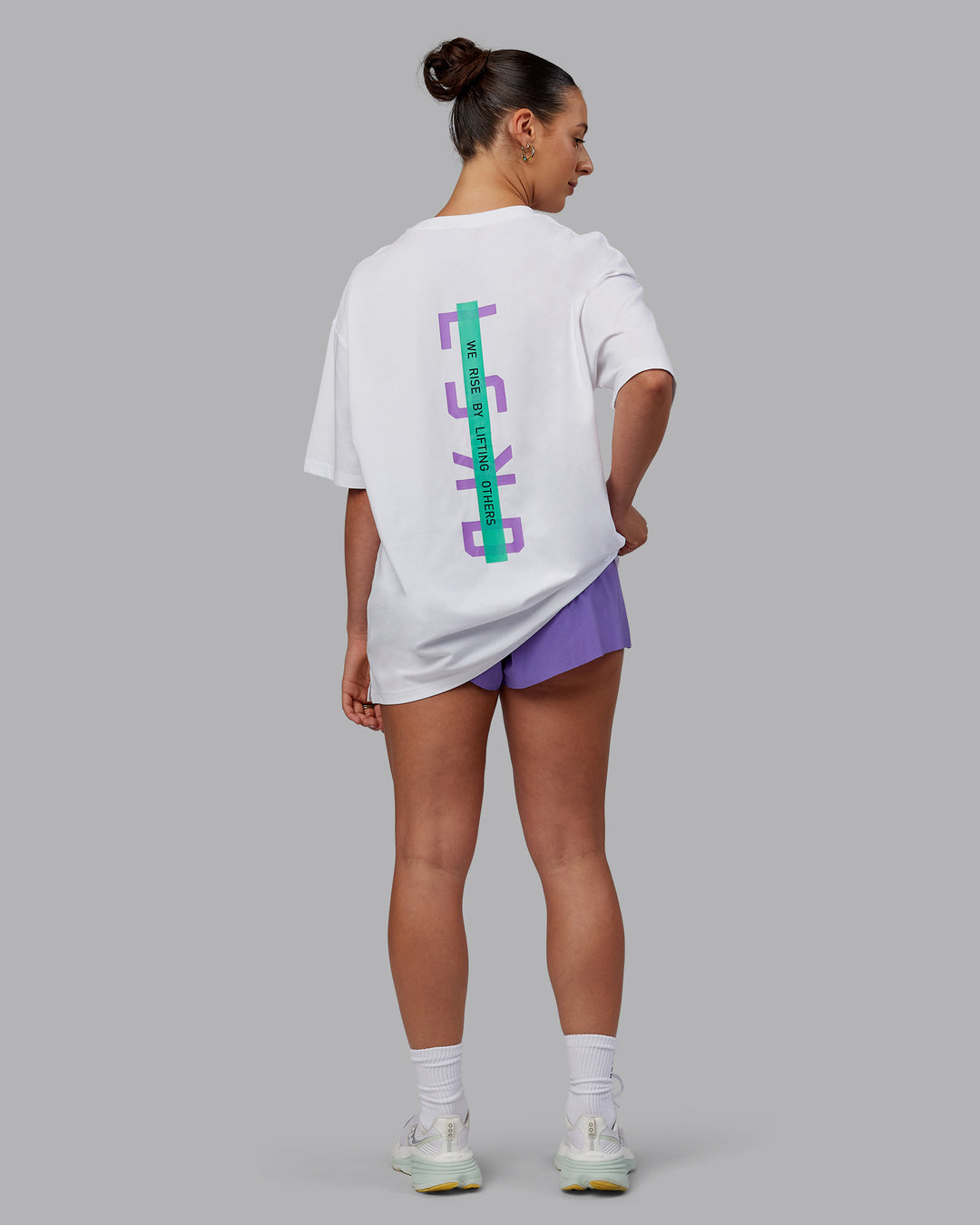 Woman wearing Unisex Strike Through FLXCotton Tee Oversize - White-Purple Swirl