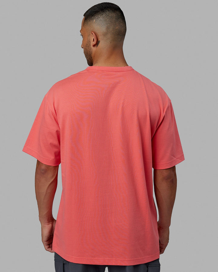 Man wearing Unisex Taylor Tee Oversize - Coral