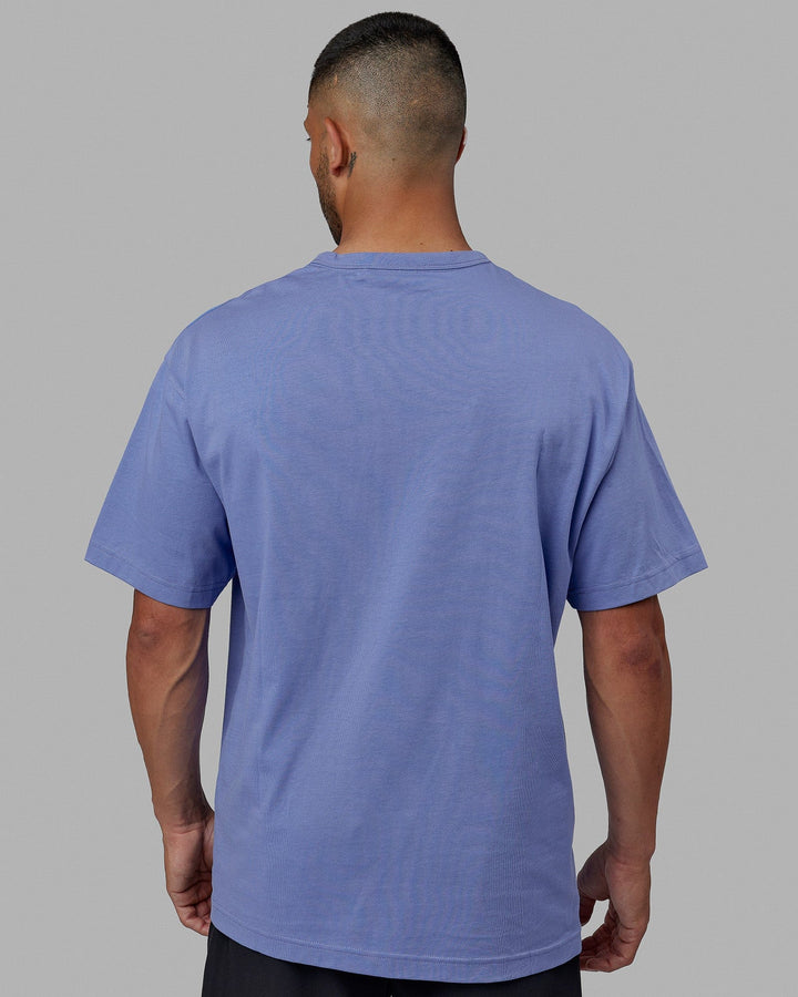 Man wearing Unisex Taylor Tee Oversize - Cornflower Blue