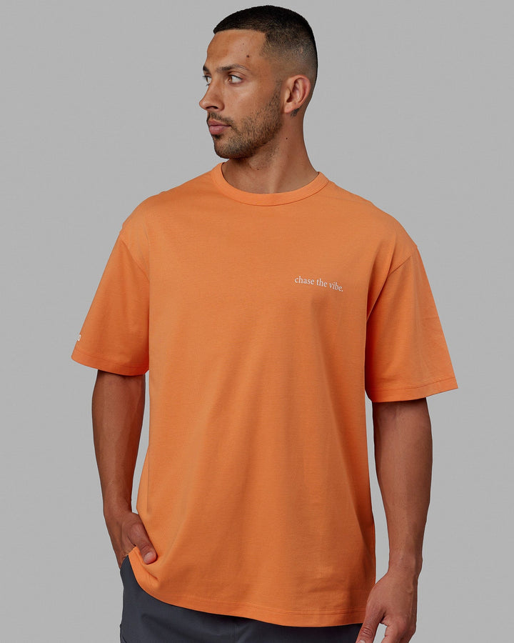 Man wearing Unisex Taylor Tee Oversize - Tangerine
