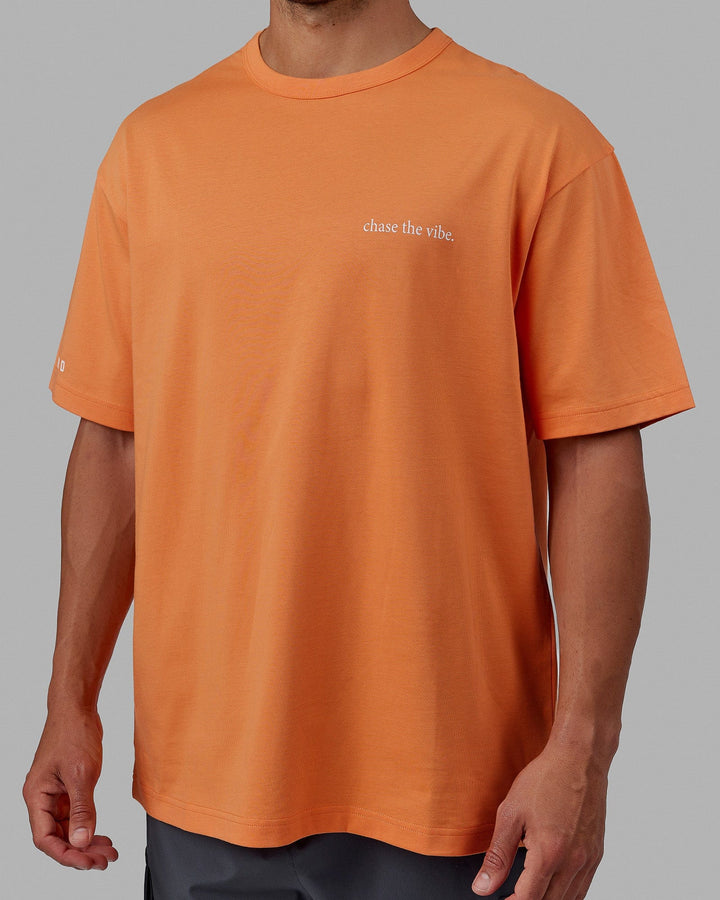 Man wearing Unisex Taylor Tee Oversize - Tangerine