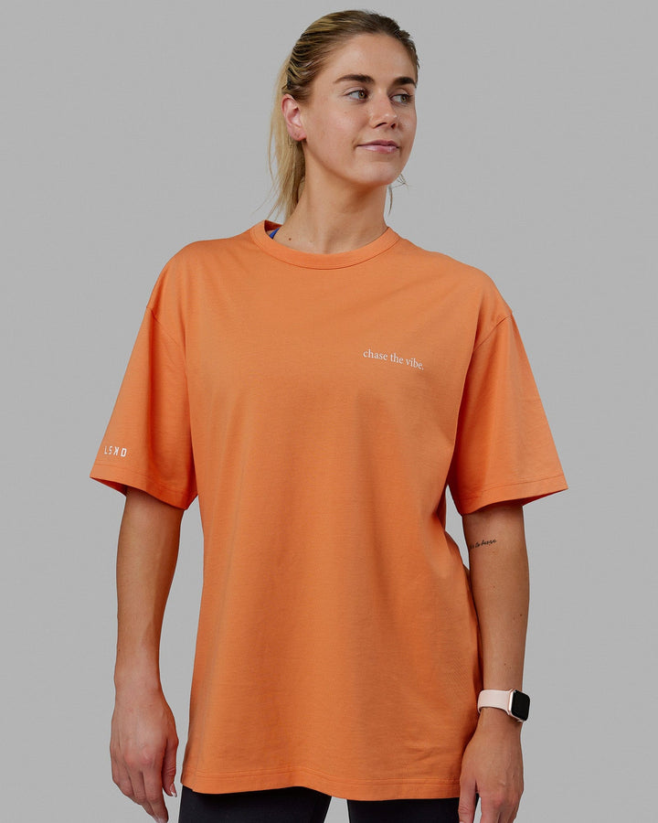 Woman wearing Unisex Taylor Tee Oversize - Tangerine
