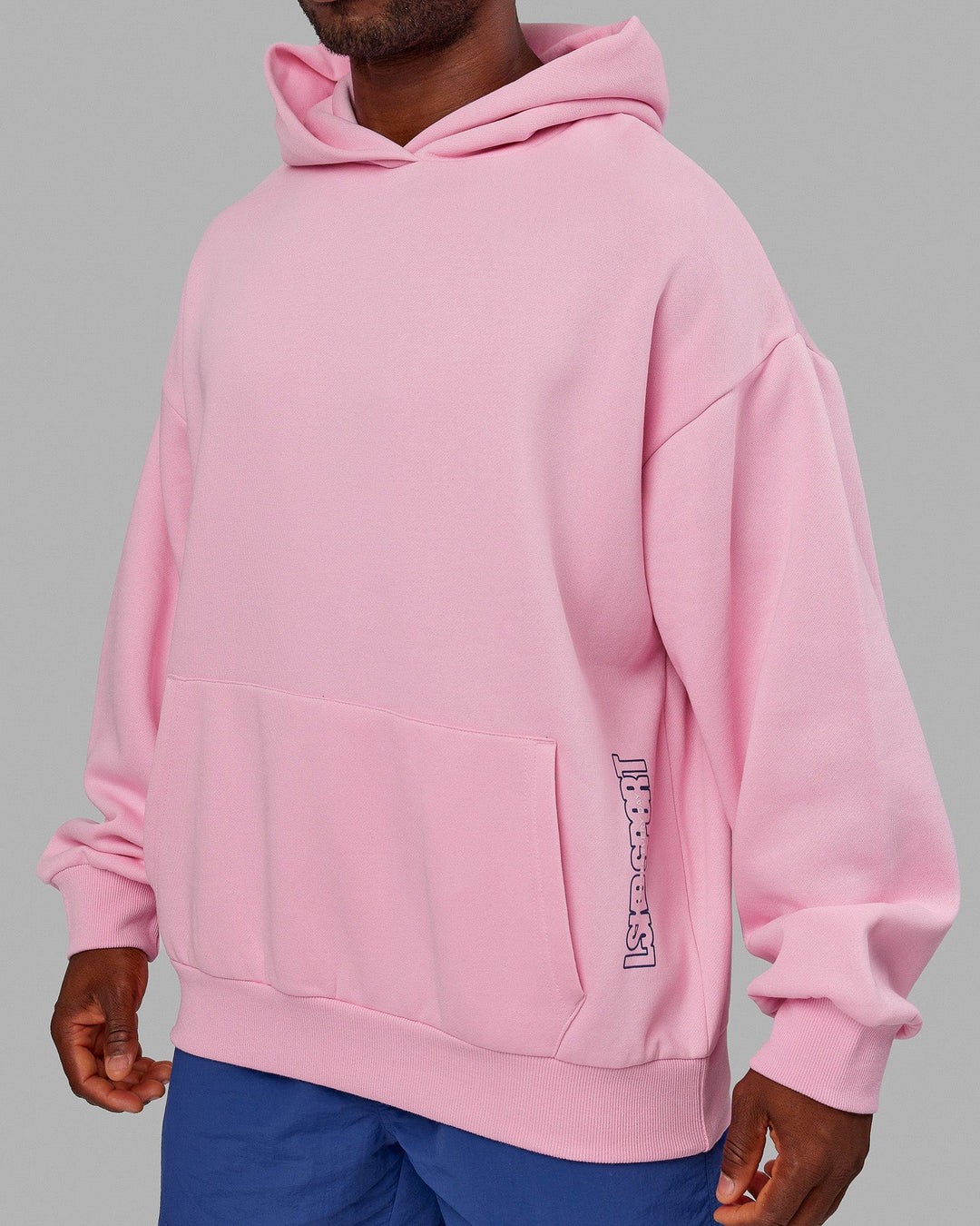 Man wearing wearing Unisex Urban Hoodie Oversize - Pink Frosting-Galactic Blue