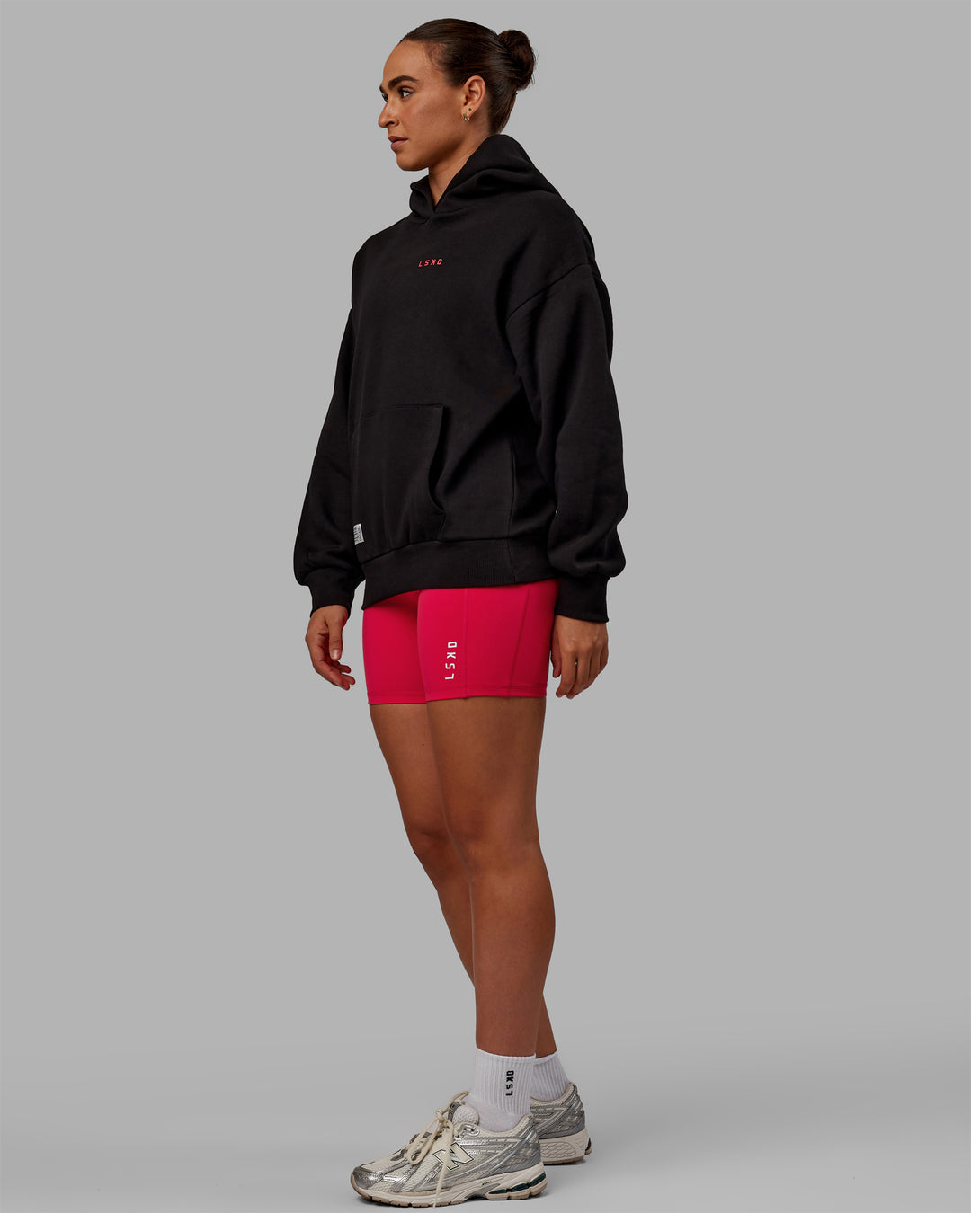 Woman wearing Unisex VS6 Hoodie Oversize - Black-Scarlet
