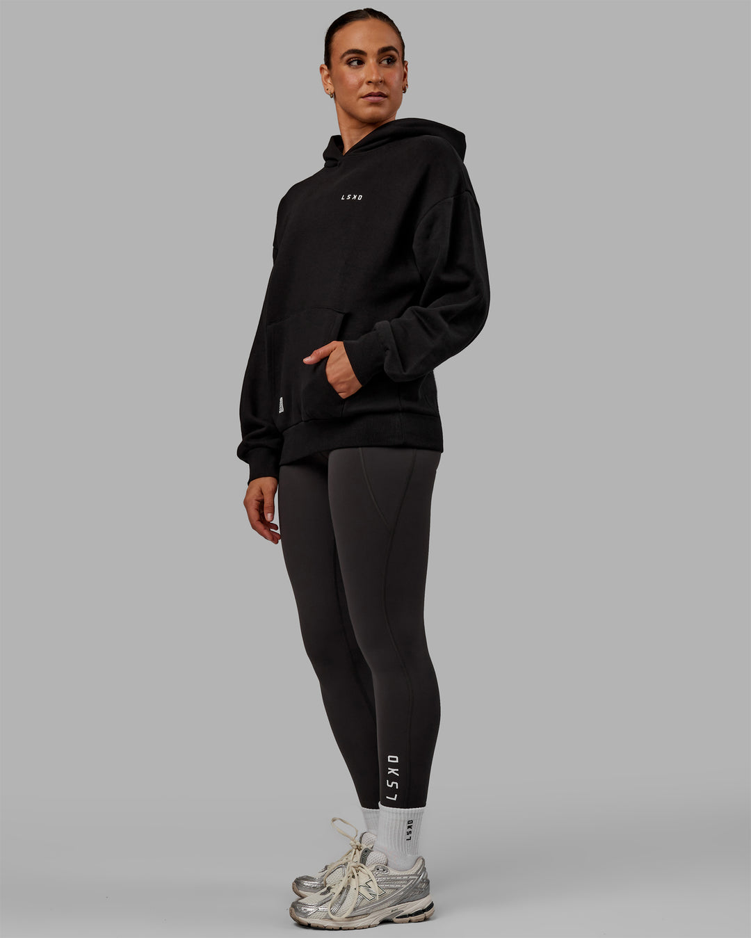 Woman wearing Unisex VS6 Hoodie Oversize - Black-White