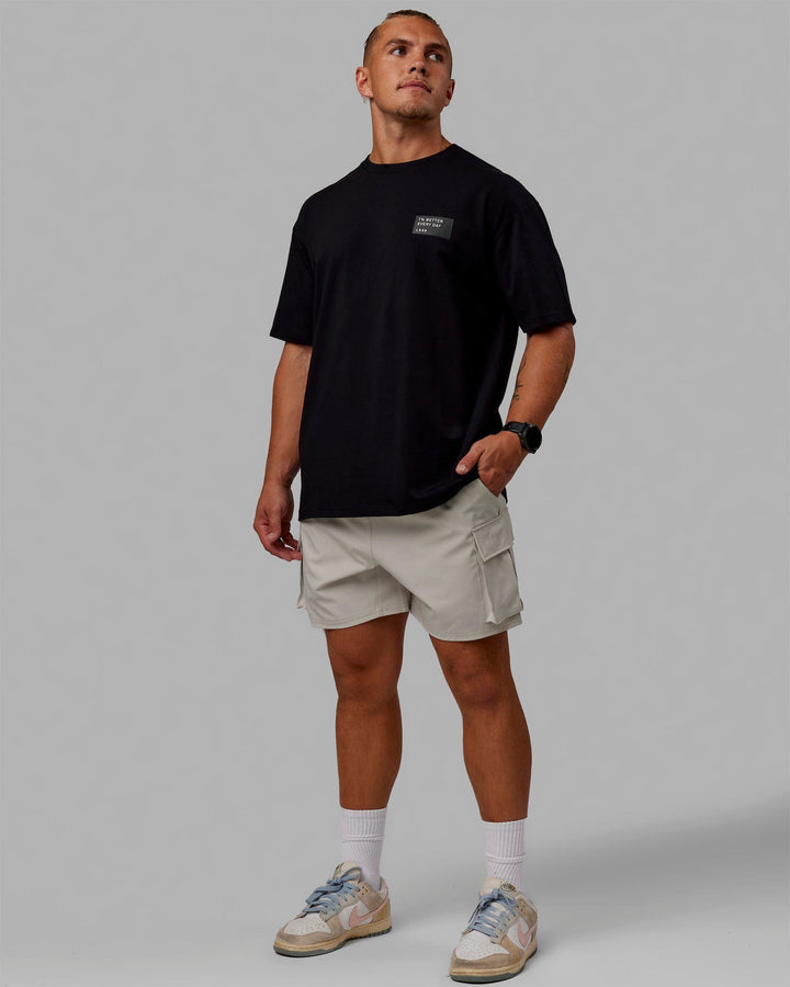 Man wearing Unisex Vertical FLXCotton Tee Oversize - Black-White
