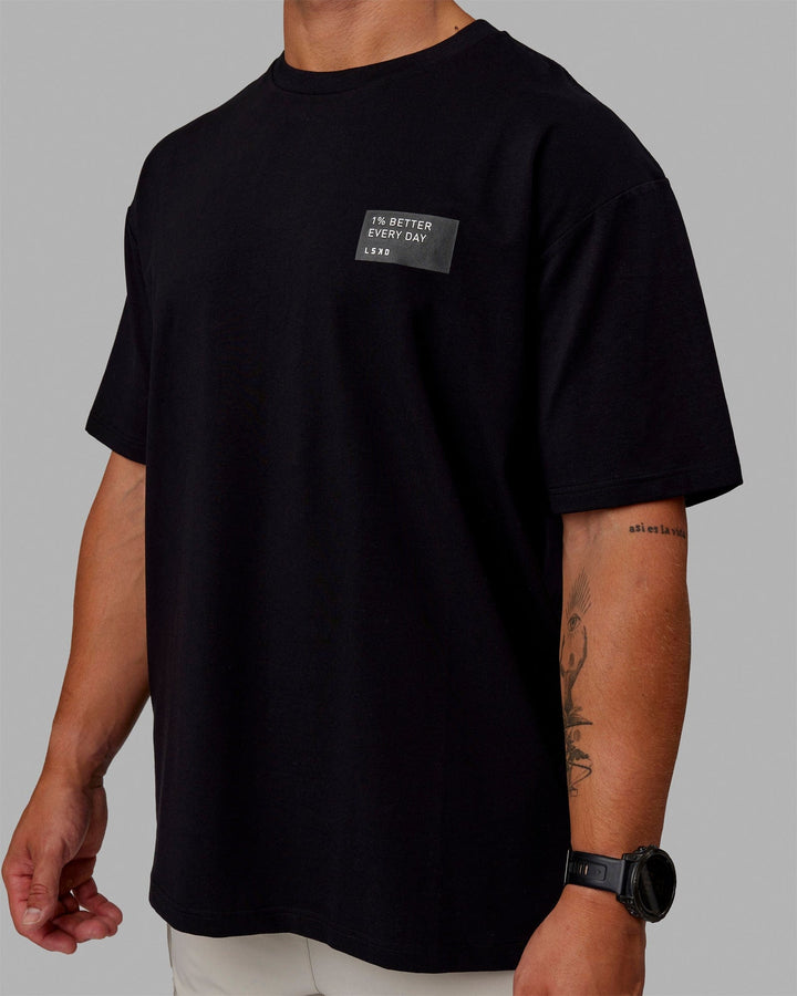 Man wearing Unisex Vertical FLXCotton Tee Oversize - Black-White