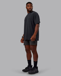Man wearing Unisex Washed RUN CLUB FLXCotton Tee Oversize - Black-Black