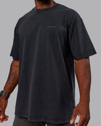 Man wearing Unisex Washed RUN CLUB FLXCotton Tee Oversize - Black-Black