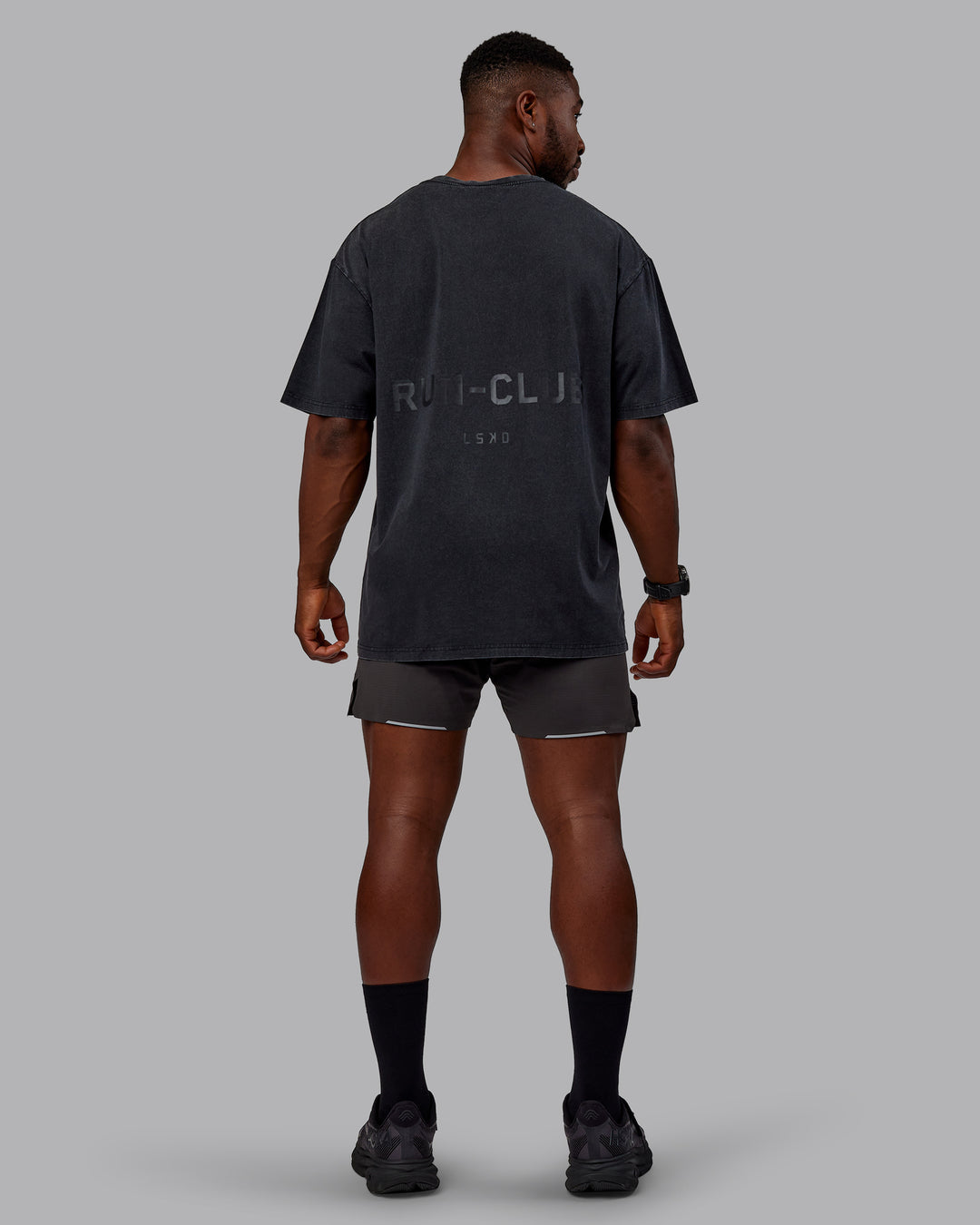 Man wearing Unisex Washed RUN CLUB FLXCotton Tee Oversize - Black-Black