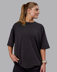 Woman wearing Unisex Washed RUN CLUB FLXCotton Tee Oversize - Black-Black