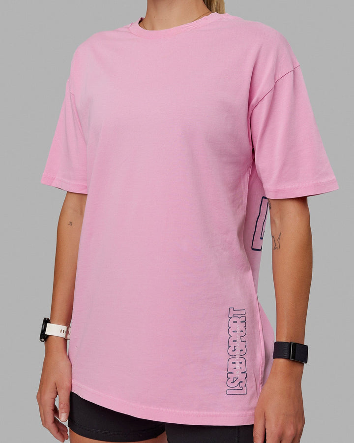 Woman wearing Unisex Washed Urban Heavyweight Tee Oversize - Pink Frosting-Galactic Blue