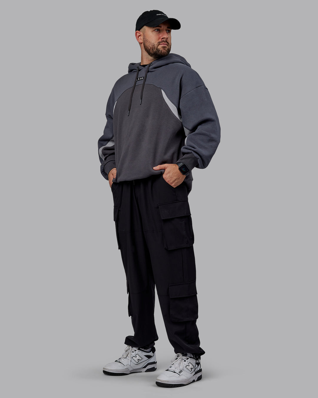 Man wearing Unisex Y2K Concept Panel Hoodie - Asphalt-Turbulance - view 9