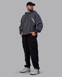 Man wearing Unisex Y2K Concept Panel Hoodie - Asphalt-Turbulance | Thumbnail Index: 8