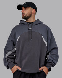 Man wearing Unisex Y2K Concept Panel Hoodie - Asphalt-Turbulance | Thumbnail Index: 3