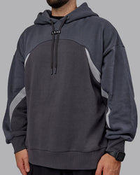 Man wearing Unisex Y2K Concept Panel Hoodie - Asphalt-Turbulance | Thumbnail Index: 10
