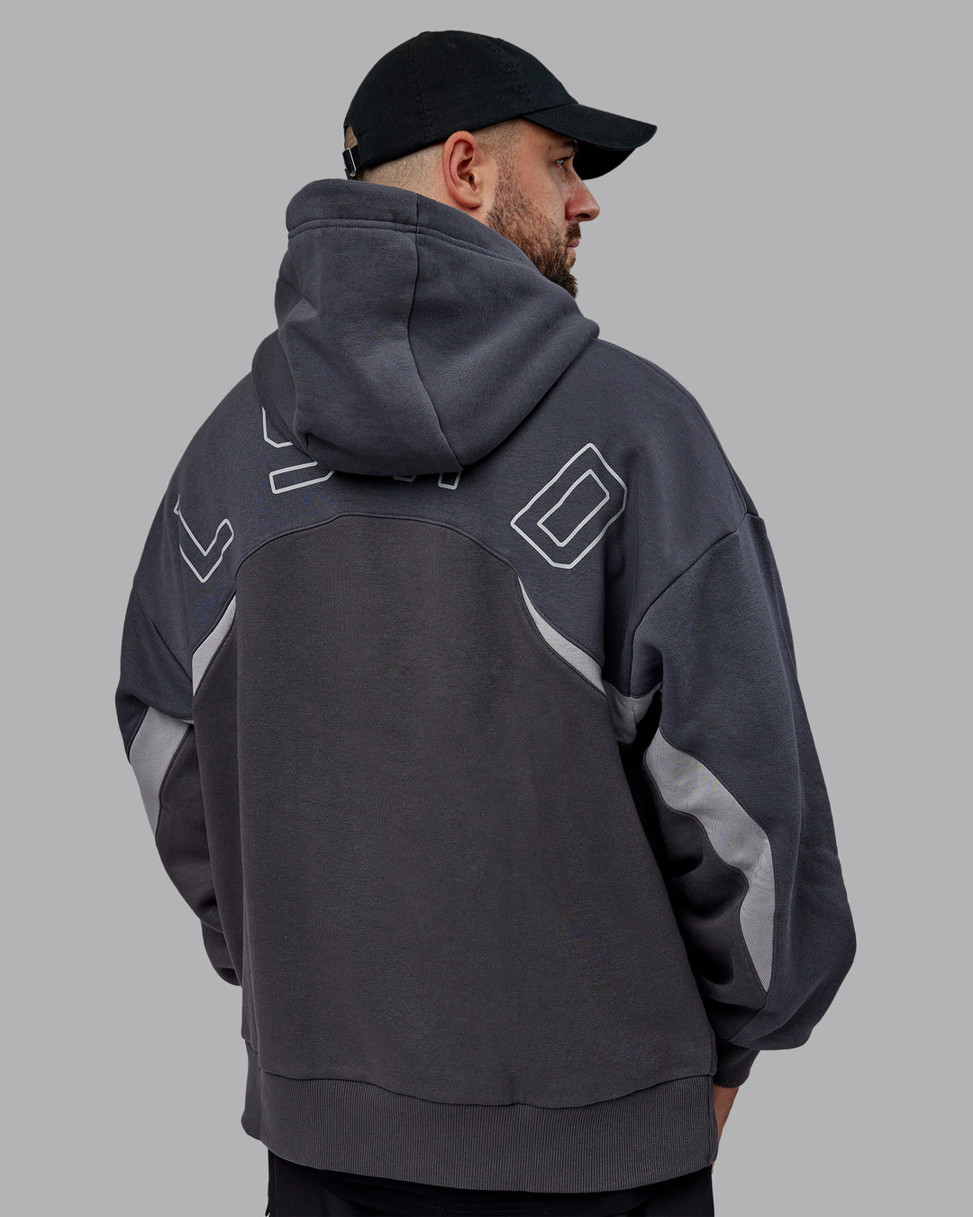 Man wearing Unisex Y2K Concept Panel Hoodie - Asphalt-Turbulance - view 13