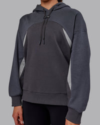 Woman wearing Unisex Y2K Concept Panel Hoodie - Asphalt-Turbulance | Thumbnail Index: 11