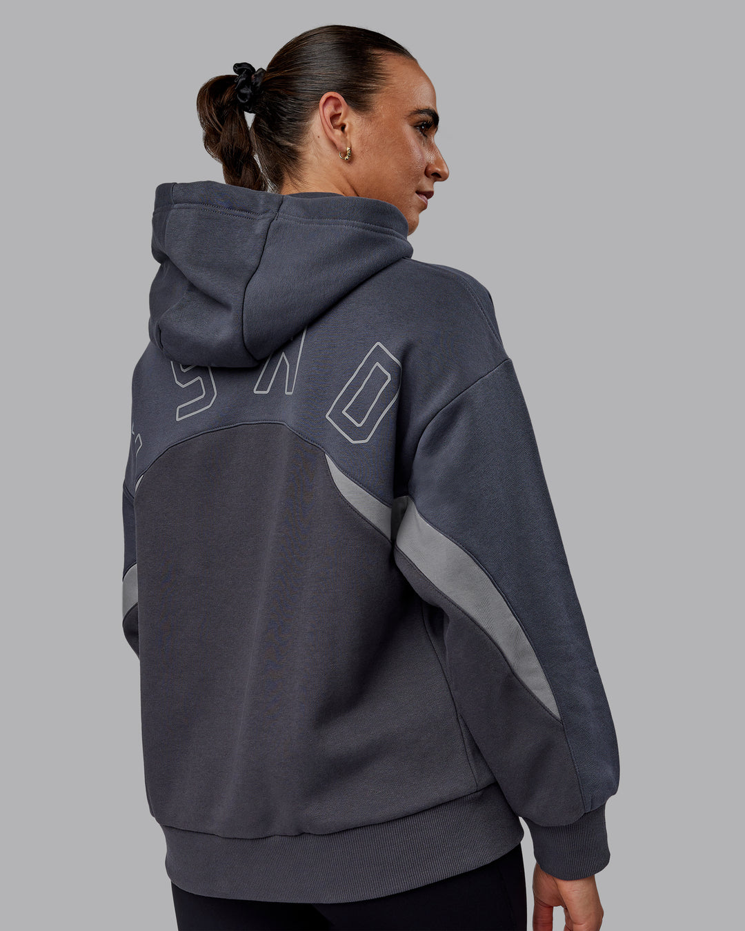 Woman wearing Unisex Y2K Concept Panel Hoodie - Asphalt-Turbulance - view 6