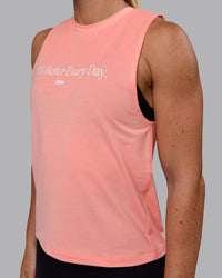 Woman wearing Unleash 1% Better Training Tank - Murex Shell-White