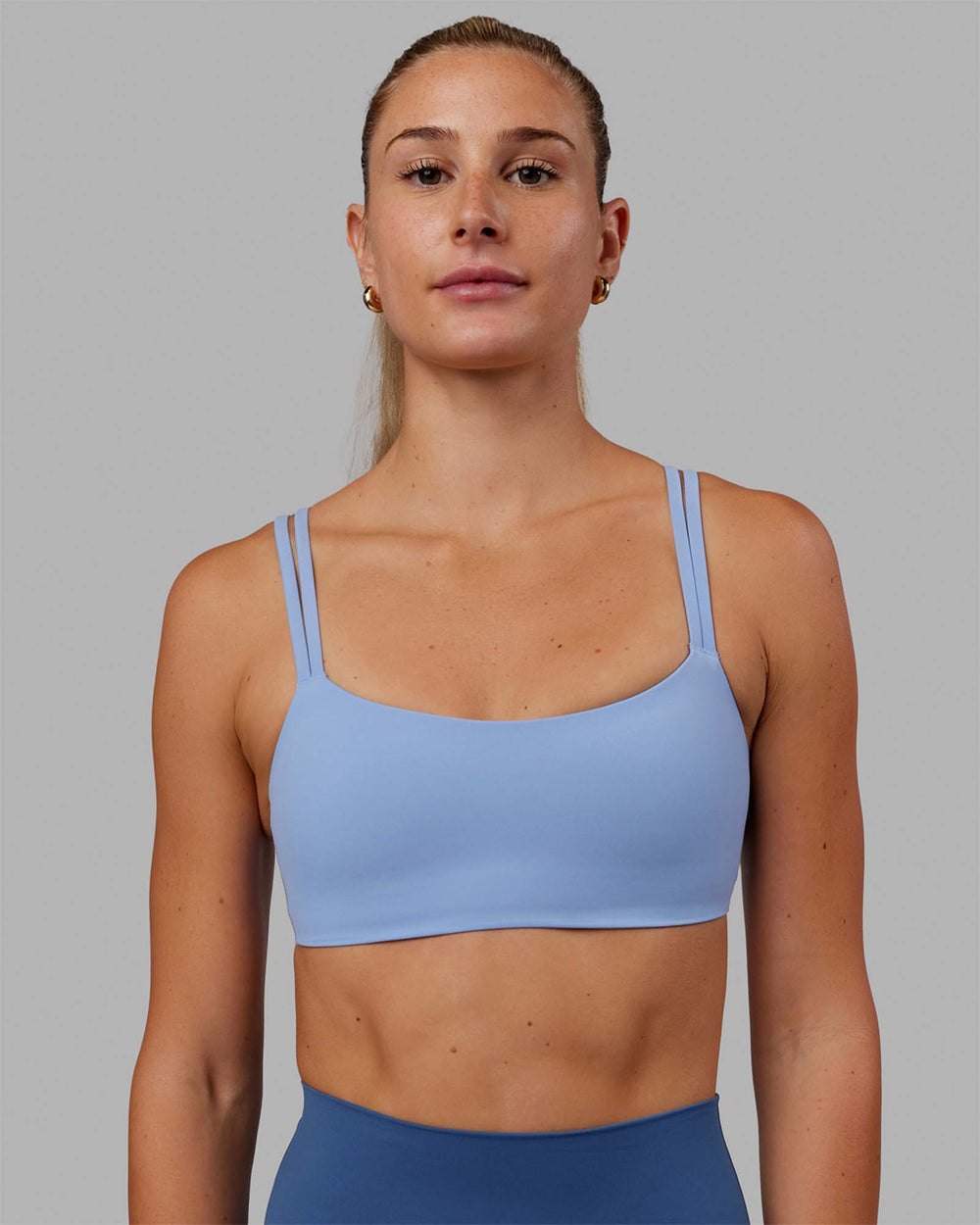 Woman wearing Vantage Sports Bra - Arctic Blue