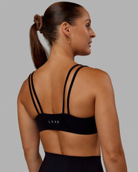 Woman wearing Vantage Sports Bra - Black