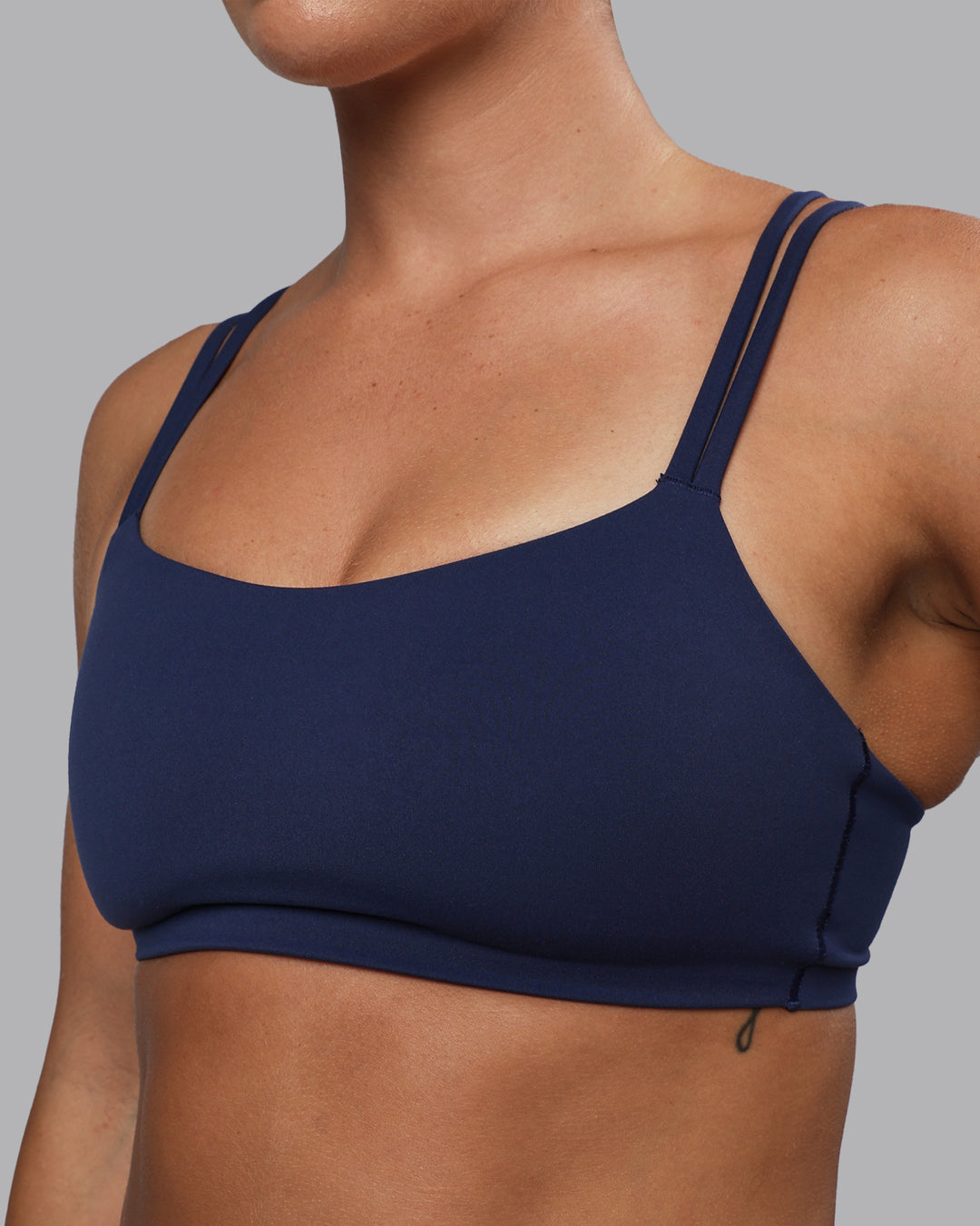 Woman wearing Vantage Sports Bra - Future Navy