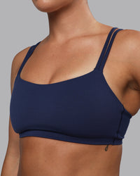 Woman wearing Vantage Sports Bra - Future Navy