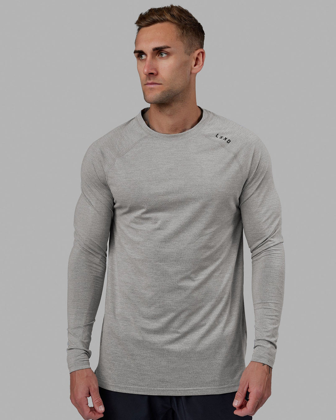 Man wearing Perform VapourFLX LS Tee - Lt Grey Marl