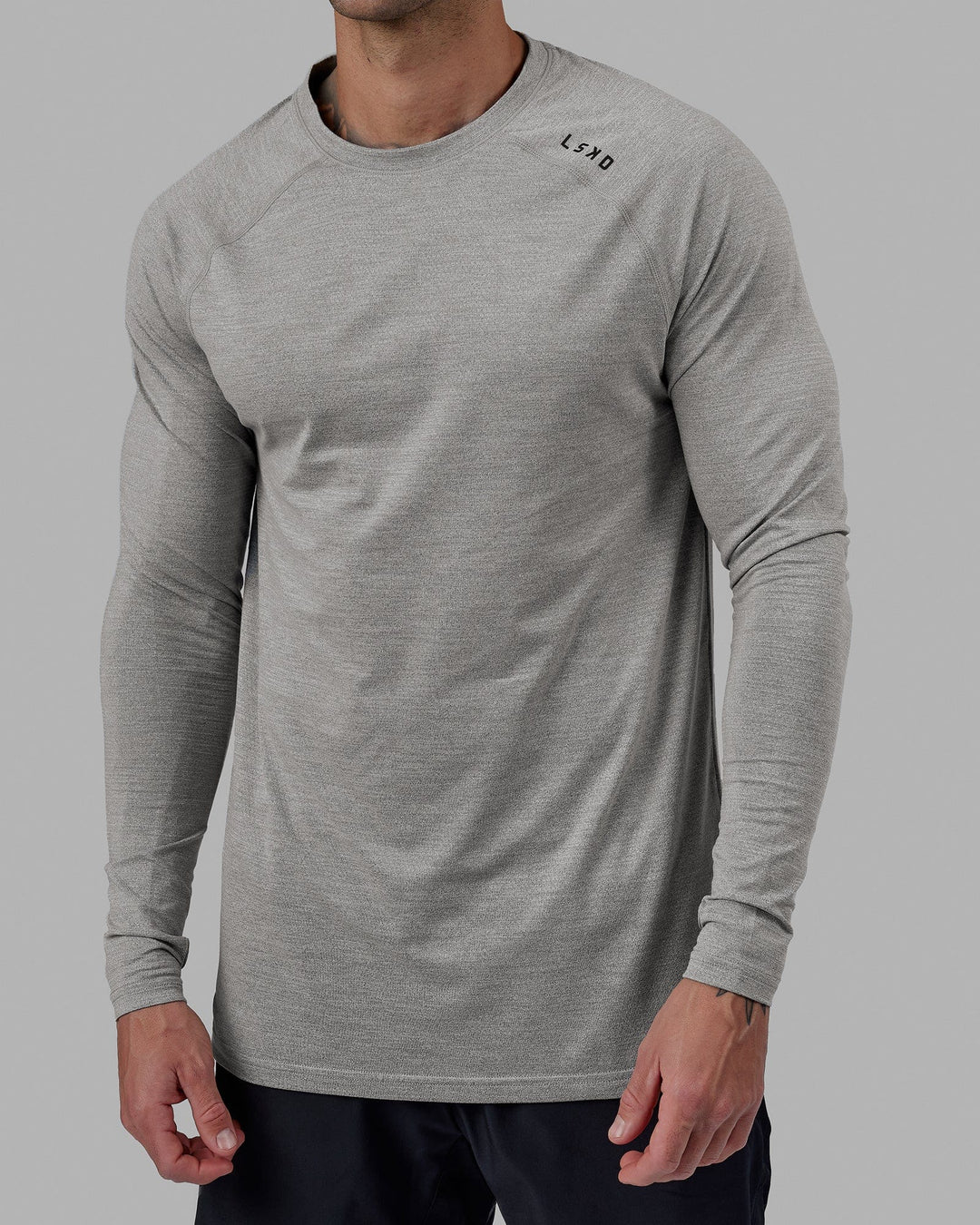 Man wearing Perform VapourFLX LS Tee - Lt Grey Marl