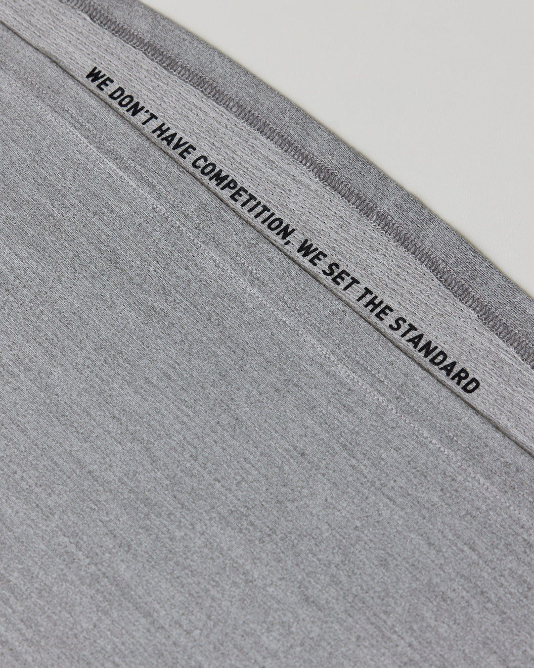 Man wearing Perform VapourFLX LS Tee - Lt Grey Marl