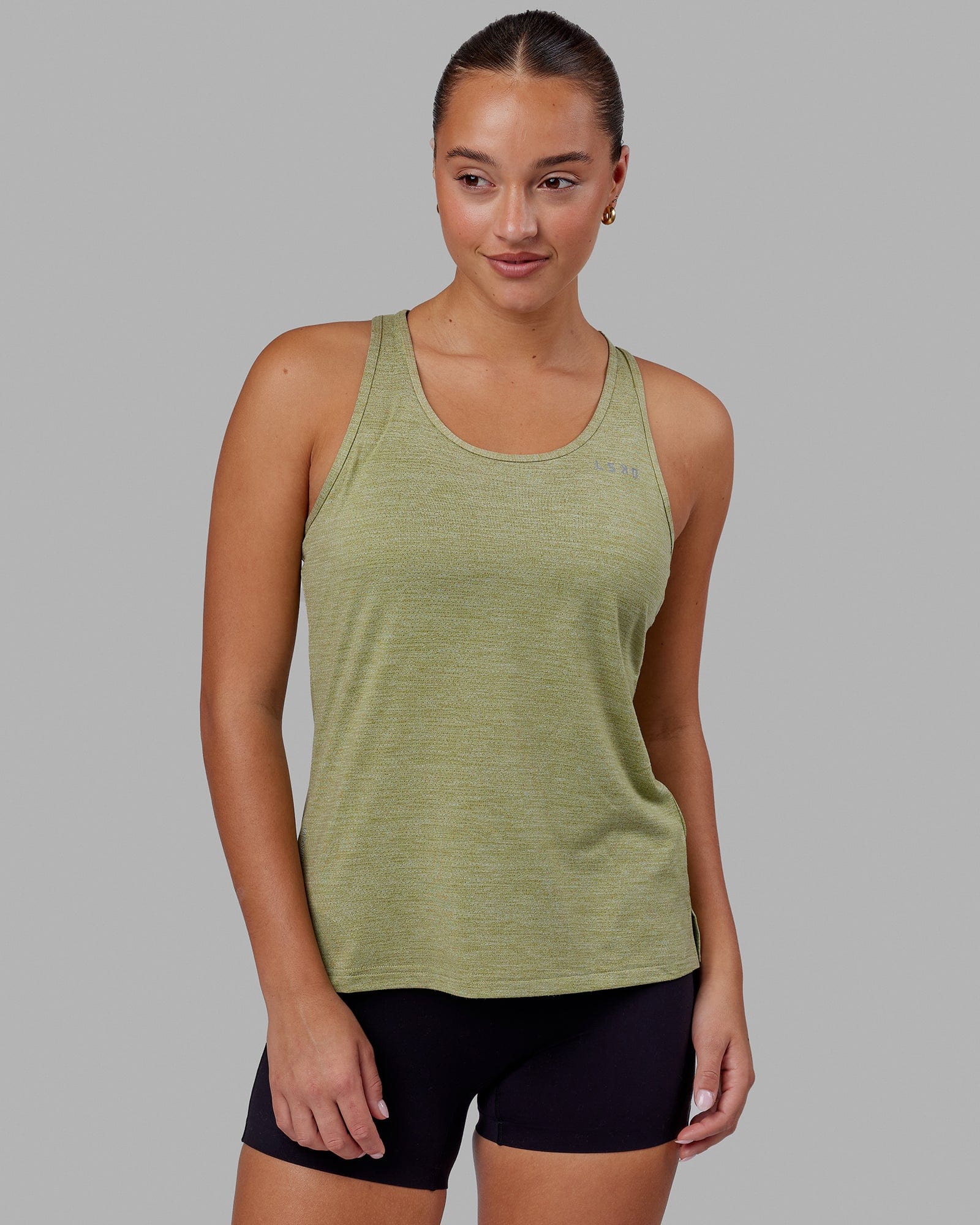 Woman wearing Perform VapourFLX Tank - Moss Stone Marl